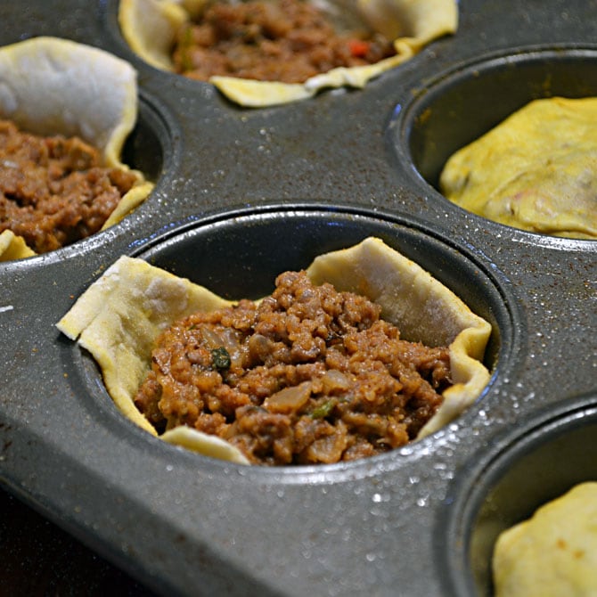 The first batch of 3-Bite Jamaican Beef Patties being filled.