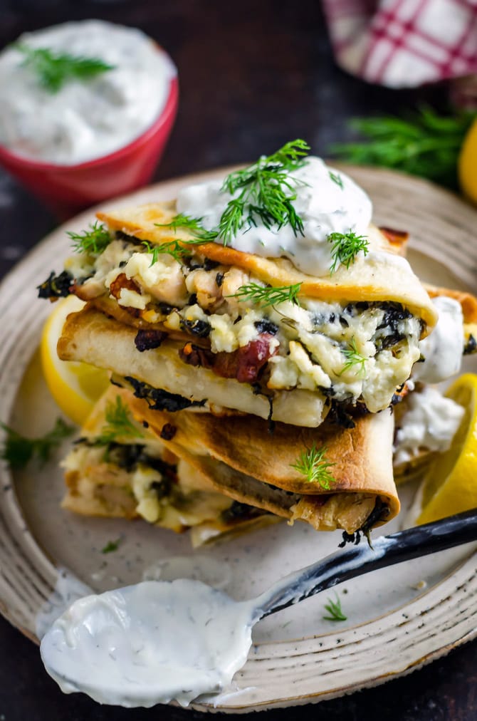 Freezer-Friendly Athenian Chicken Quesadillas. Load these Greek-inspired quesadillas up with tangy marinated chicken, bacon, feta and mozzarella cheeses, and spinach, and then dig in... or save them for later! Great for meal prep. | hostthetoast.com