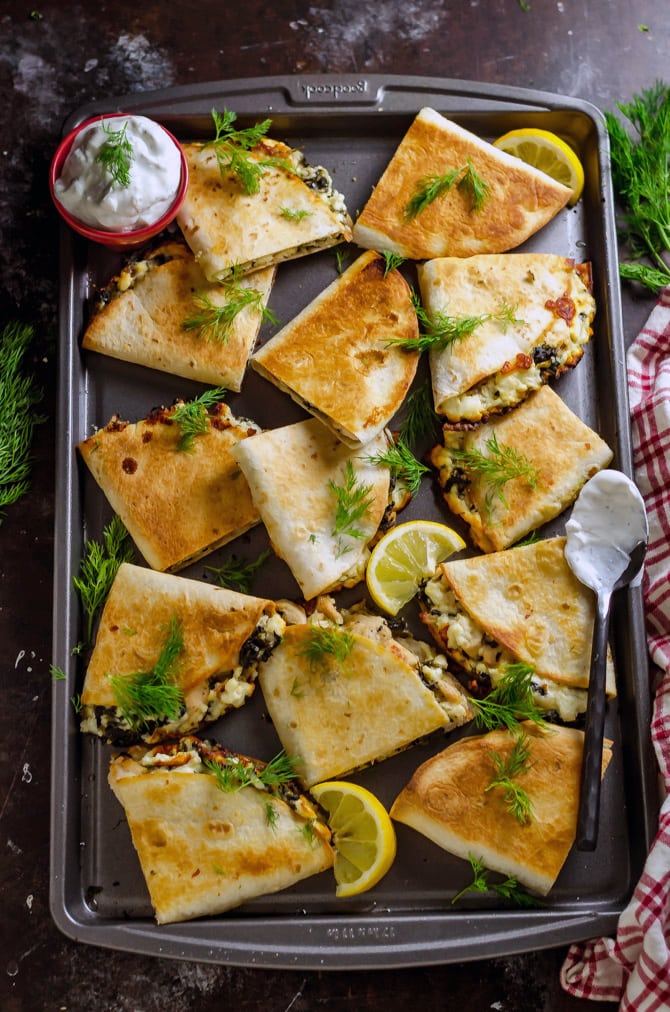 Freezer-Friendly Athenian Chicken Quesadillas. Load these Greek-inspired quesadillas up with tangy marinated chicken, bacon, feta and mozzarella cheeses, and spinach, and then dig in... or save them for later! Great for meal prep. | hostthetoast.com