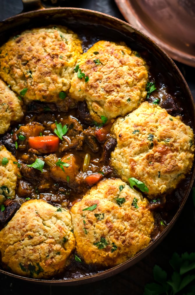 Guinness Beef Stew with Cheddar Herb Dumplings. Rich, comforting, and deeply flavorful. | hostthetoast.com