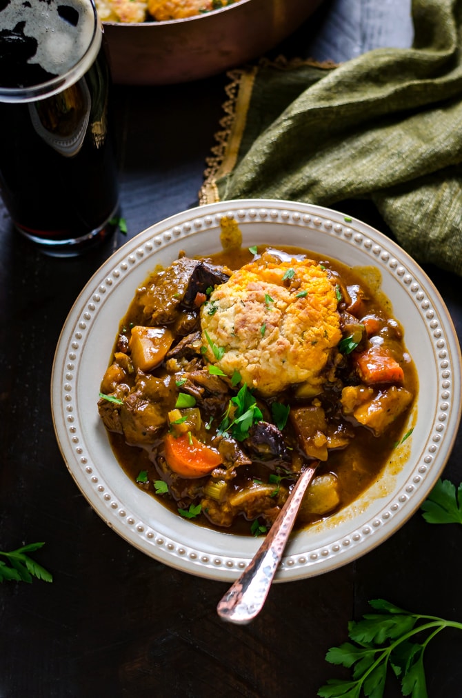 Guinness Beef Stew with Cheddar Herb Dumplings. Rich, comforting, and deeply flavorful. | hostthetoast.com