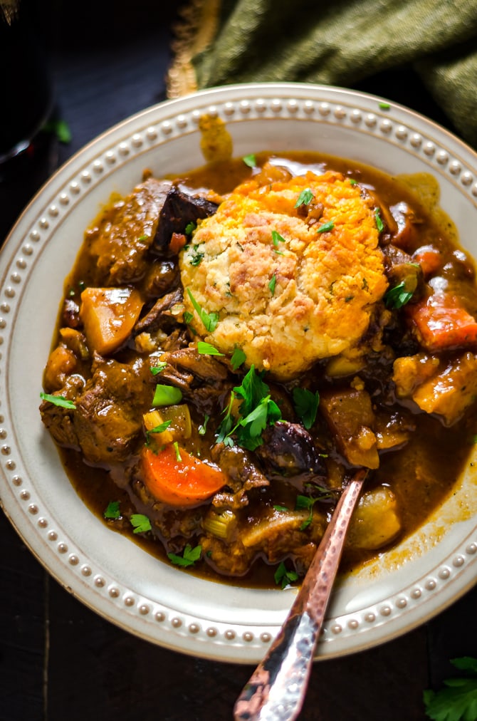Guinness Beef Stew with Cheddar Herb Dumplings. Rich, comforting, and deeply flavorful. | hostthetoast.com
