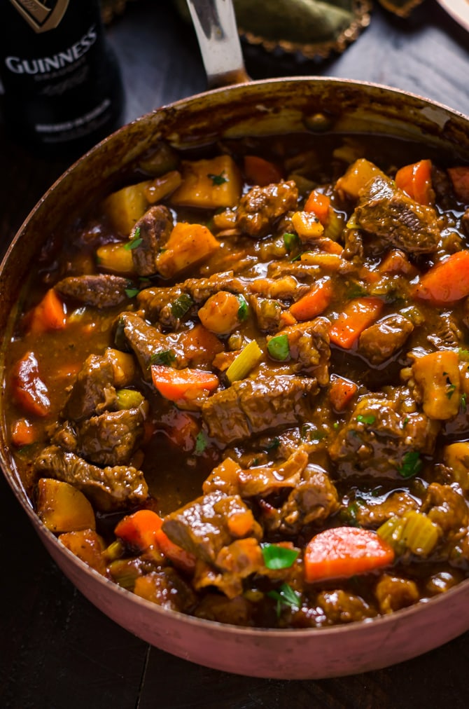 Guinness Beef Stew with Cheddar Herb Dumplings. Rich, comforting, and deeply flavorful. | hostthetoast.com