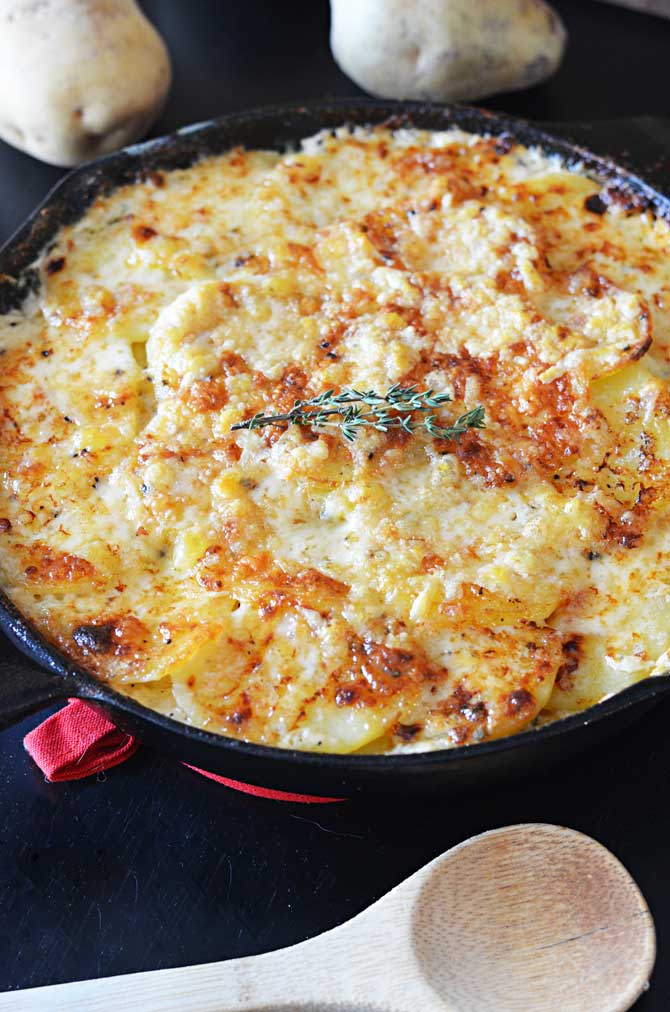 Skillet Scalloped Potatoes!  This super cheesy side dish makes my heart flutter. | hostthetoast.com