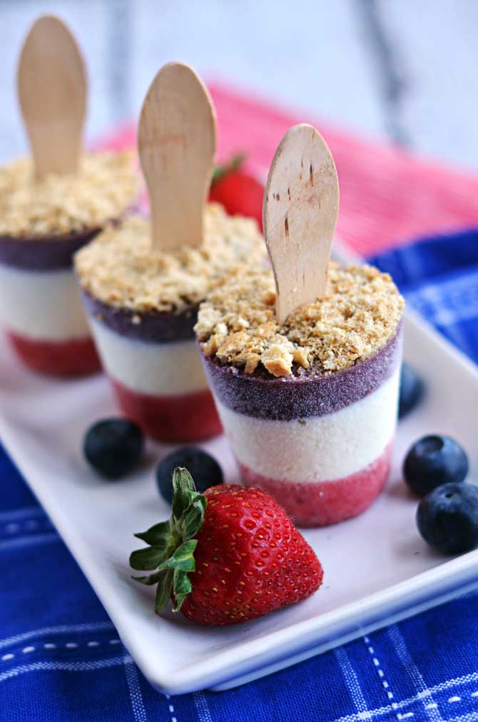 Boozy Red, White, and Blueberry Cheesecake Popsicles. Perfect for Memorial Day Weekend, Fourth of July, Labor Day Weekend, or just any summer party! So delicious you should make several batches ;) | hostthetoast.com