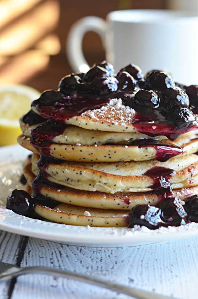 Lemon Ricotta Poppy Seed Pancakes with Blueberry Sauce.   If breakfast is the most important meal of the day, do it right.  | hostthetoast.com