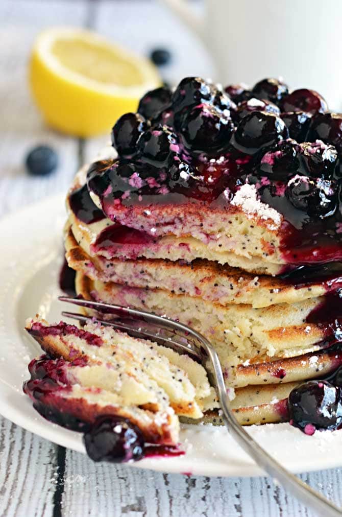 Lemon Ricotta Poppy Seed Pancakes with Blueberry Sauce.   If breakfast is the most important meal of the day, do it right.  | hostthetoast.com