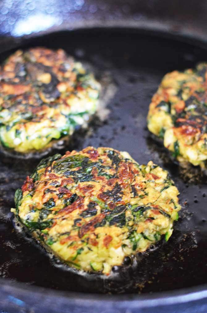 Zucchini, Feta, and Spinach Fritters with Garlic Tzatziki! Great for appetizers or a light snack, and a fantastic way to sneak in some veggies! | hostthetoast.com