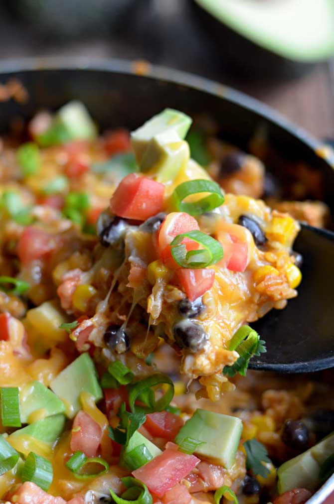 One Pot Cheesy Chicken Taco Rice. This 30 minute, one pot meal will become a quick family favorite!