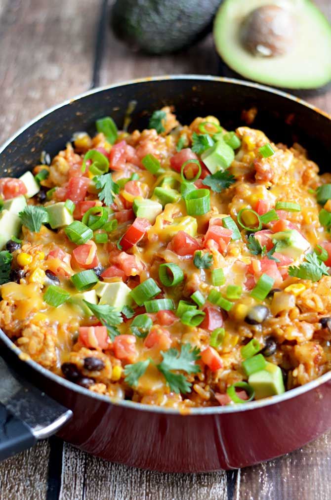 One Pot Cheesy Chicken Taco Rice. This 30 minute, one pot meal will become a quick family favorite!