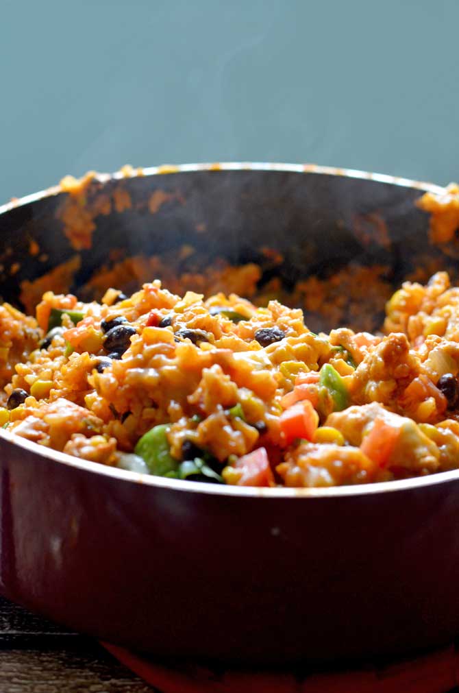 One Pot Cheesy Chicken Taco Rice. This 30 minute, one pot meal will become a quick family favorite!