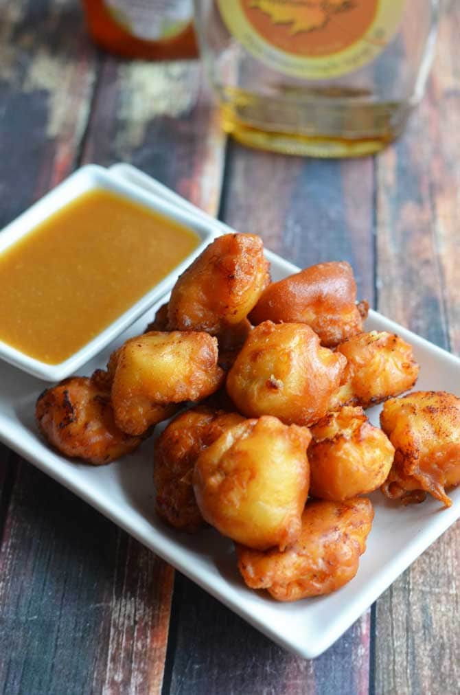 Maple Waffle Chicken Nuggets.  These chicken nuggets are coated in maple-y waffle batter and served with a honey maple mustard dip.  Perfect for parties or game day! | hostthetoast.com