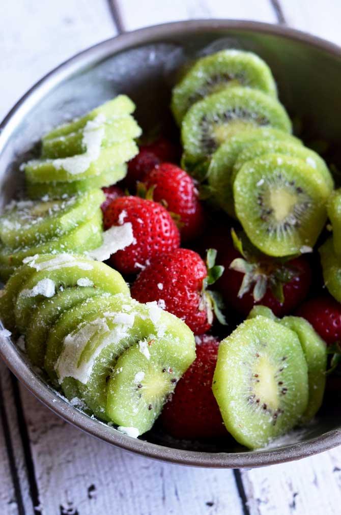 Strawberry-Kiwi Frozen Mojito. Fresh fruit, mint, rum, simple syrup, and ice makes this the PERFECT summer drink. It tastes even better than it looks! | hostthetoast.com