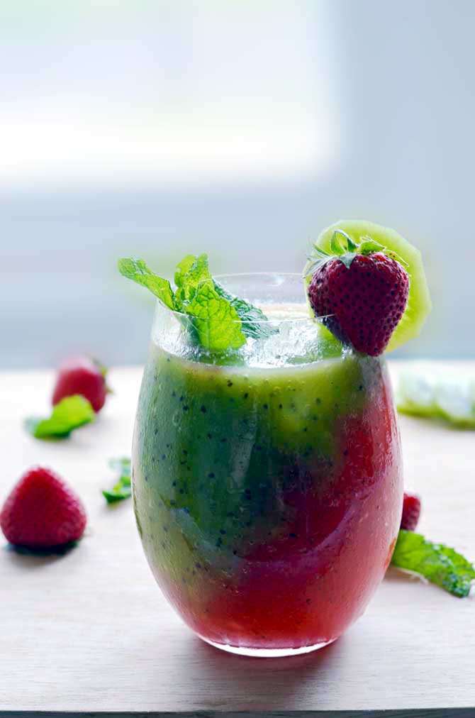 Strawberry-Kiwi Frozen Mojito. Fresh fruit, mint, rum, simple syrup, and ice makes this the PERFECT summer drink. It tastes even better than it looks! | hostthetoast.com