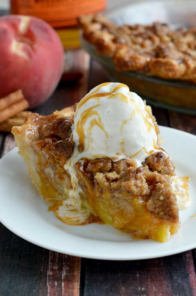 Maple Bourbon Brown Butter Peach Pie. This is probably the most delicious dessert to ever grace the face of the earth. Fresh peaches, maple-bourbon caramel, pecan brown butter streusel, buttery, flaky pie crust, and vanilla bean ice cream. | hostthetoast.com