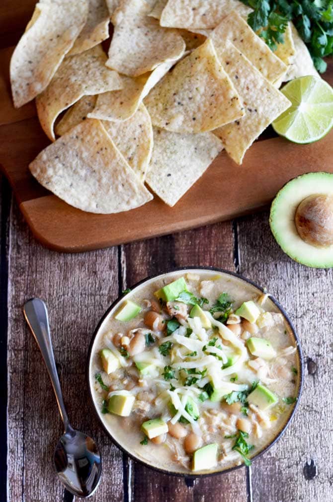 Crock Pot White Bean Chili.  This creamy white chili is absolutely delicious and easy to make in the slow cooker.  Also, it doesn't use any canned soups! | hostthetoast.com