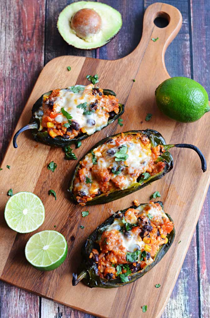 Mexican Stuffed Peppers. Roasted poblanos stuffed with chorizo, rice, beans, corn, and cheese! So good, I had to make them again. | hostthetoast.com
