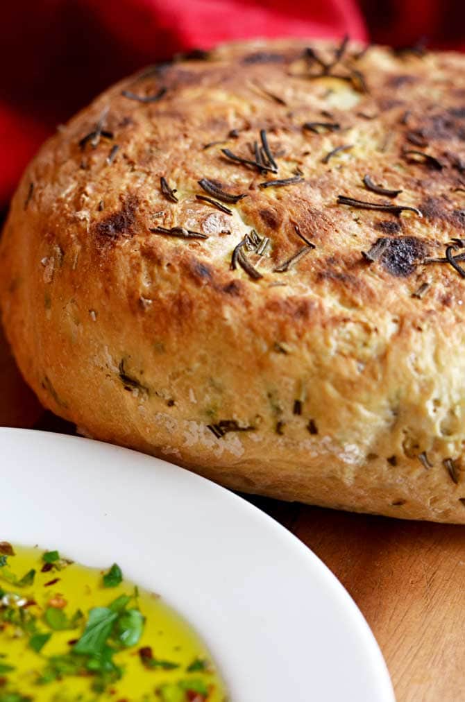 Rosemary Olive Oil Crock Pot Bread!  That's right, this bread is actually made in the slow cooker, and it comes out so tender and flavorful!  It's become one of my most popular recipes of all time! | hostthetoast.com