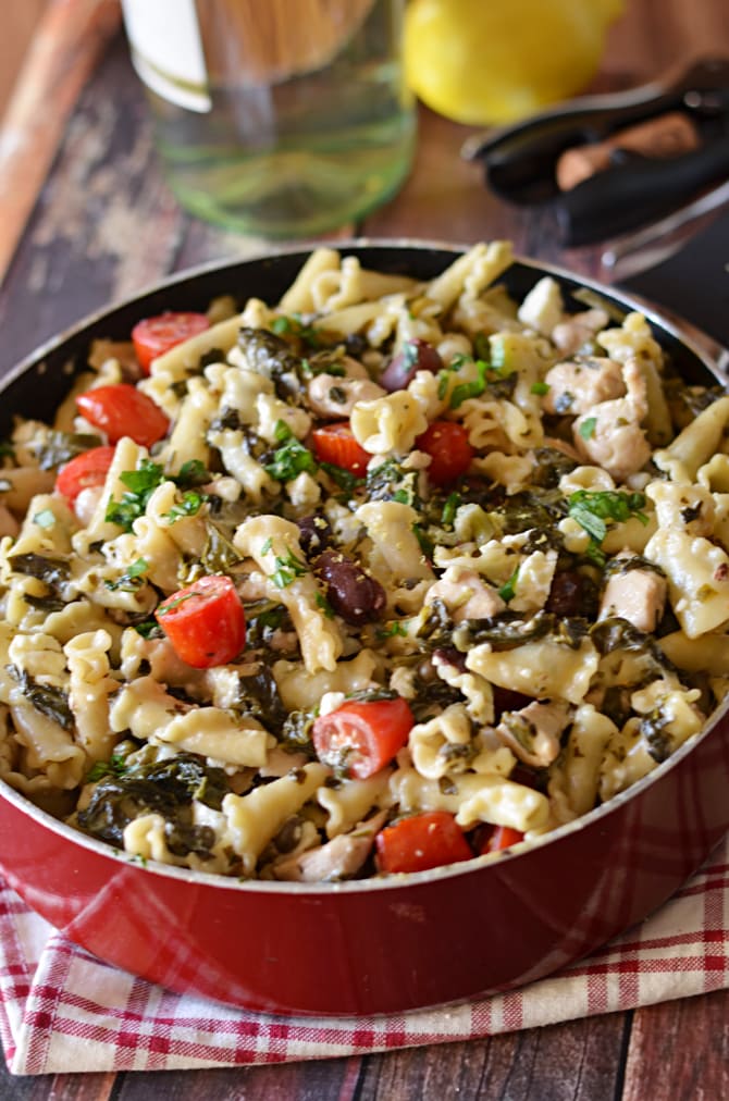 One Pot Greek Chicken Pasta with Creamy Feta Wine Sauce.  You don't even need to boil the noodles first-- just cook it all in one pot!  Easy and impressive dinner. | hostthetoast.com