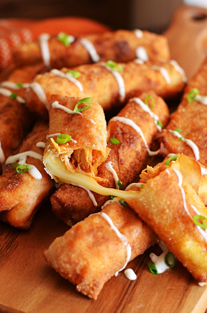 Buffalo Chicken Mozzarella Logs. This mash-up of everybody's favorite appetizers (wings, mozzarella sticks, and egg rolls) is just begging to be made for the Super Bowl. | hostthetoast.com