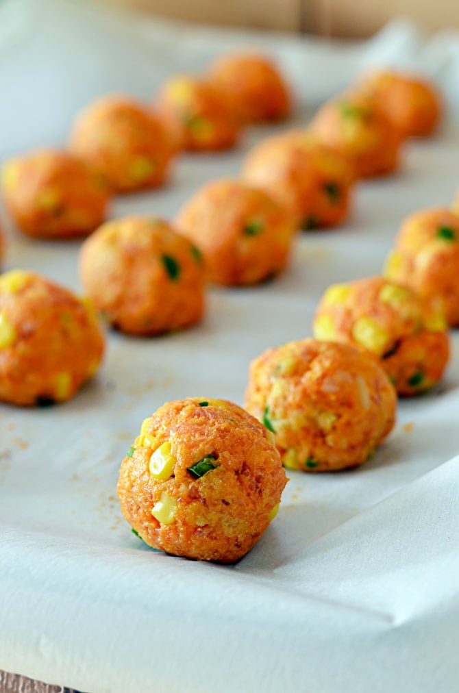Cheesy Chorizo Cornbread Balls with Chipotle Dipping Sauce.  The upgraded version of Sausage Balls-- so good for parties.  Must have for the Super Bowl. | hostthetoast.com