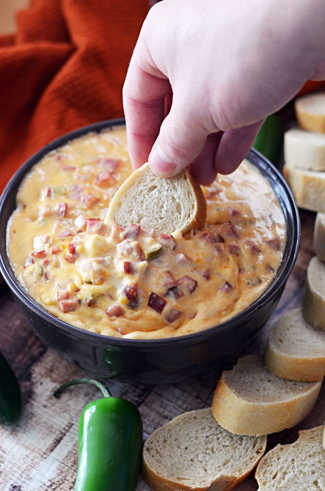 Sweet Heat Kielbasa Dip.  Jalapeno, hot sauce, and apricot preserves give this cheesy, meaty dip a ton of flavor!  Just throw it all in the crock pot and serve warm! | hostthetoast.com