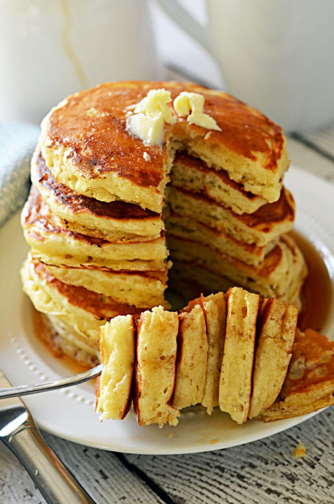 Fluffy Old Fashioned Pancakes.  These pancakes are almost as easy as bisquick, and don't require buttermilk (but you still get that signature flavor!)  Check out the recipe to find out how to make the most perfect pancakes in just minutes. | hostthetoast.com