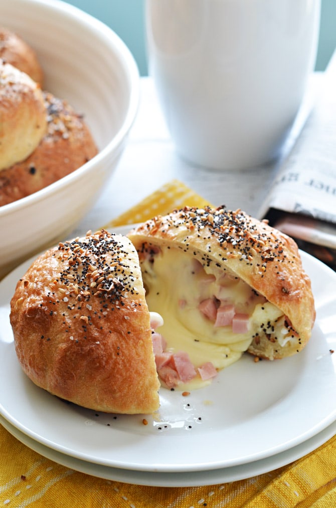 Freezer-Friendly Everything Bagel Bombs. Cheese, ham, and eggs are stuffed into bagel-ified dough for the perfect reheatable breakfast for busy mornings. Only 240 calories per serving! | hostthetoast.com