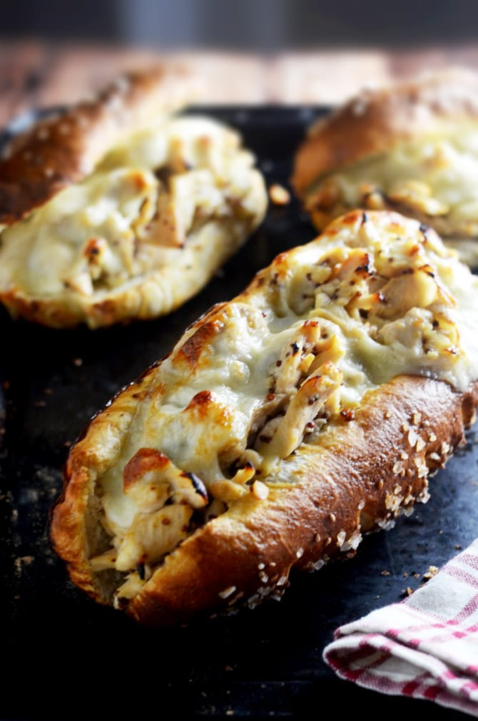 Honey Dijon Chicken Cheesesteaks with Pretzel Rolls. You need to make these ASAP. The pretzel rolls are made with frozen bread and baking soda! | hostthetoast.com