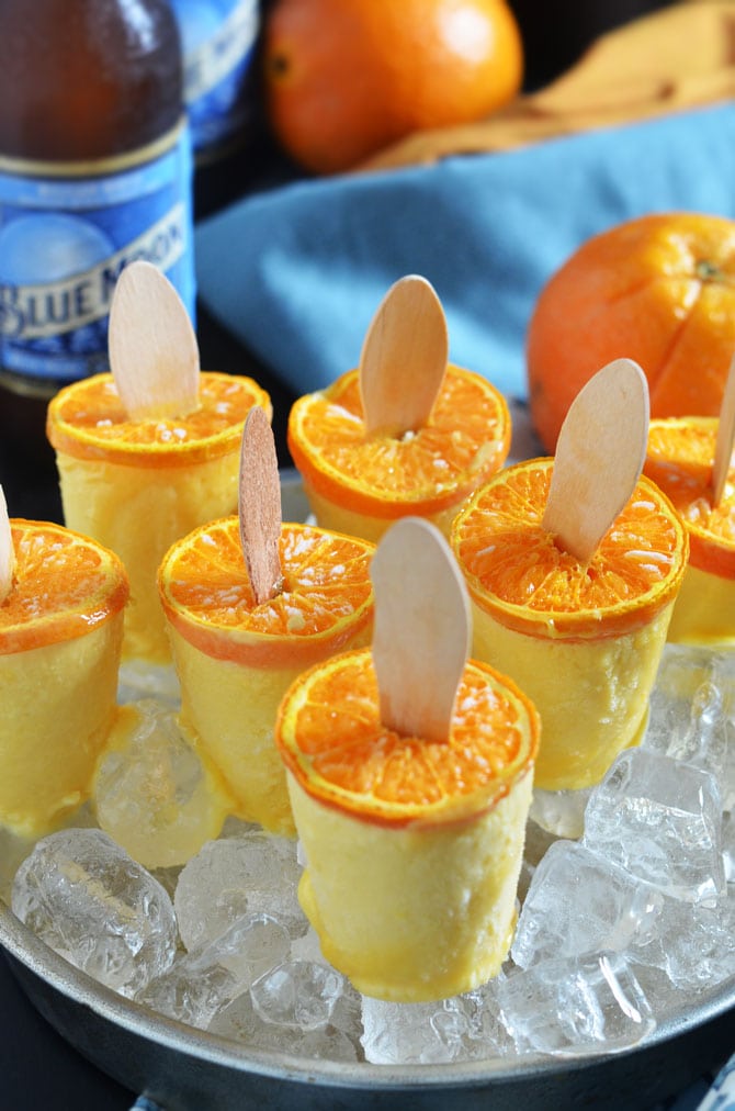 Blue Moon Orange Creamsicles. These boozy popsicles will be the star of your BBQ or party! Easy to make, too! | hostthetoast.com