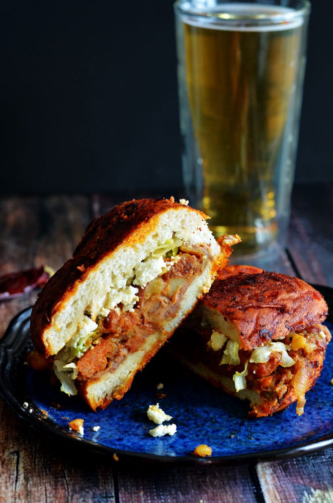 Pambazos (Mexican Salsa-Dunked Sandwiches). They're filled with potatoes, chorizo sausage, and refried beans! | hostthetoast.com