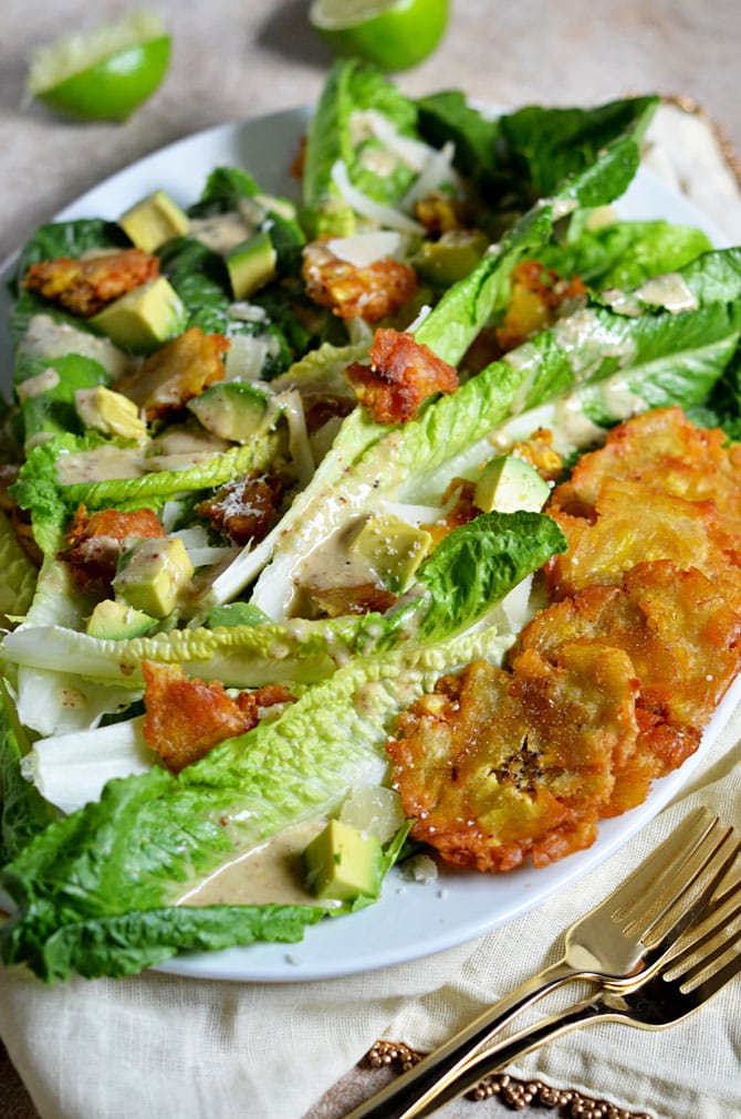 Cuban Caesar Salad. This twist on the classic Caesar features tostones, avocado, manchego cheese, and a zesty dressing that I can't get enough of. | hostthetoast.com