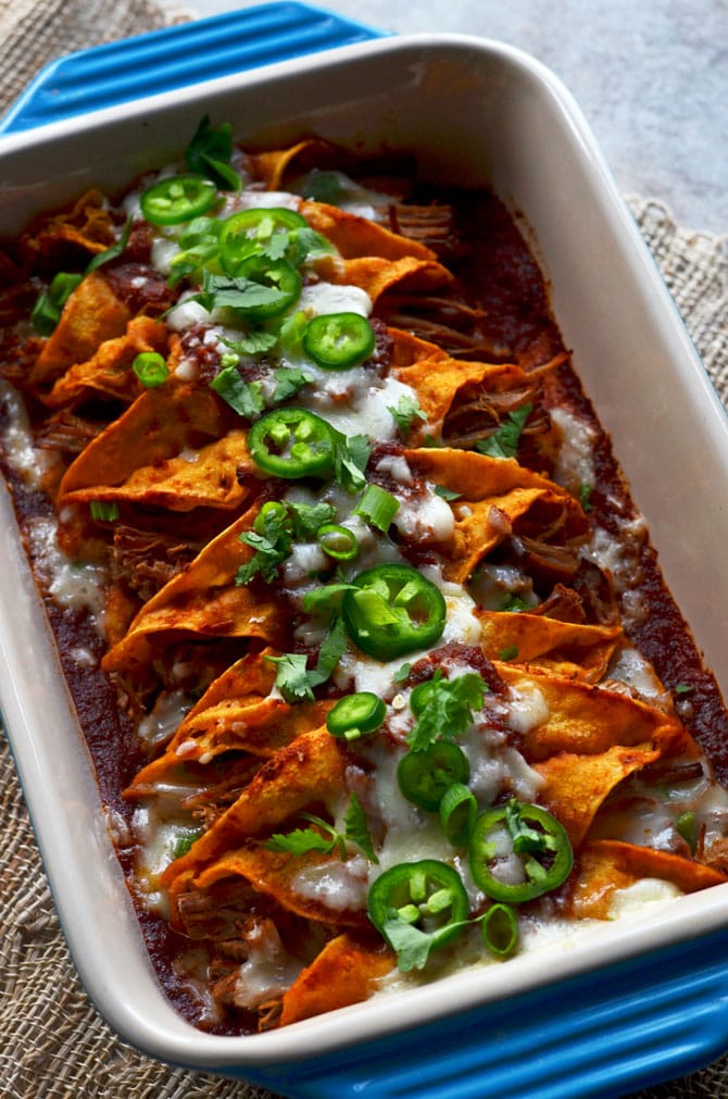 Slow Cooker Honey Chipotle Stout Enchiladas. The beef and sauce is cooked in the slow cooker for ultra tender, flavor packed enchiladas that will rock your tastebuds. | hostthetoast.com
