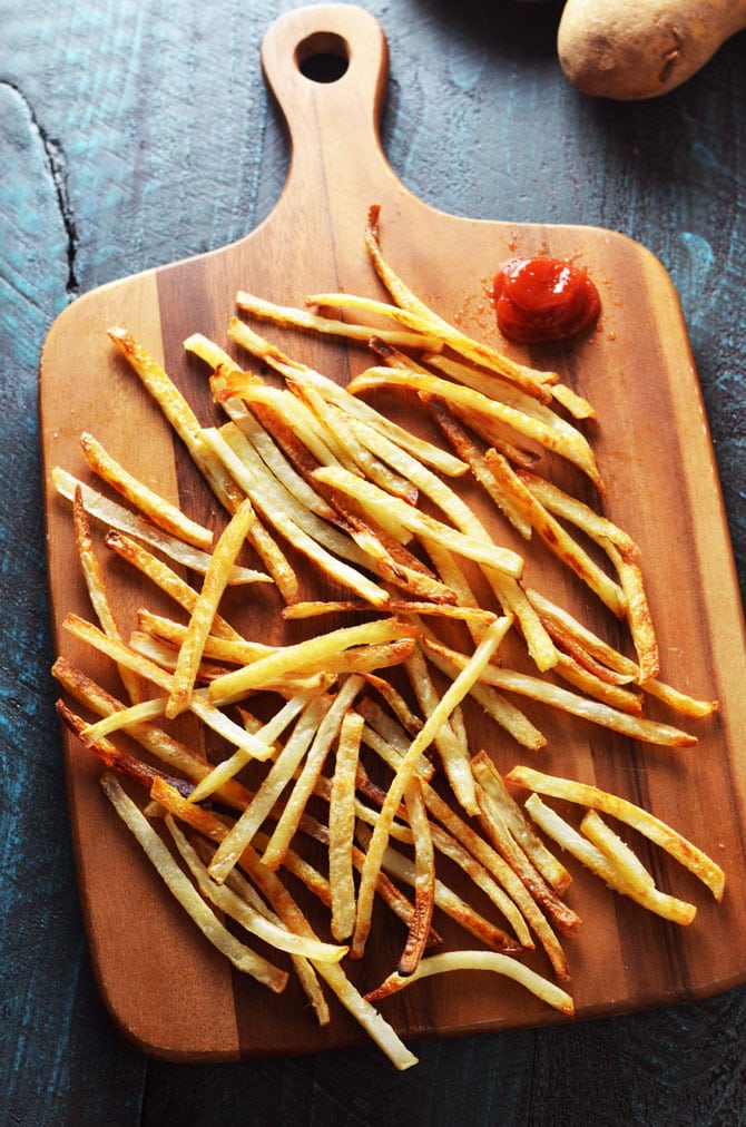 Baked French Fries. These thin, crispy, fluffy fries are just as addictive as the fast food version, but healthier and super easy to make! | hostthetoast.com