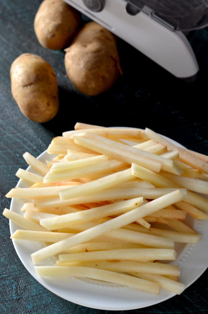 Baked French Fries. These thin, crispy, fluffy fries are just as addictive as the fast food version, but healthier and super easy to make! | hostthetoast.com
