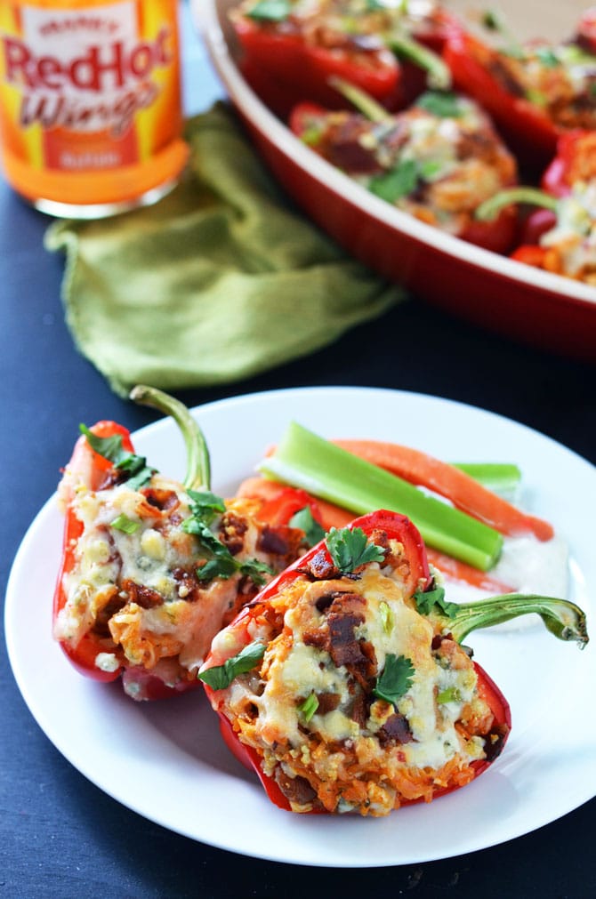 Buffalo Chicken Stuffed Peppers! These spicy stuffed peppers are loaded with monterrey jack and blue cheeses, bacon, tender shredded chicken breasts, and plenty of buffalo sauce! | hostthetoast.com