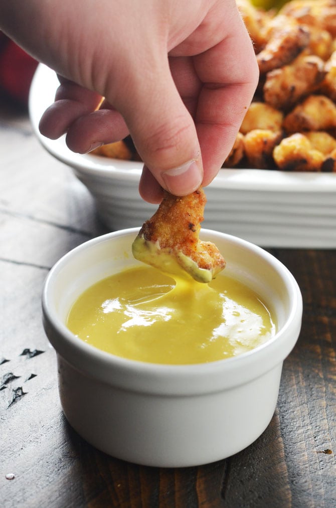 Baked Chicken Nuggets with Honey Mustard Dip. This baked version of the famous Chick-Fil-A nuggets is healthier, hassle-free, absolutely delicious, and easy to make at home! | hostthetoast.com