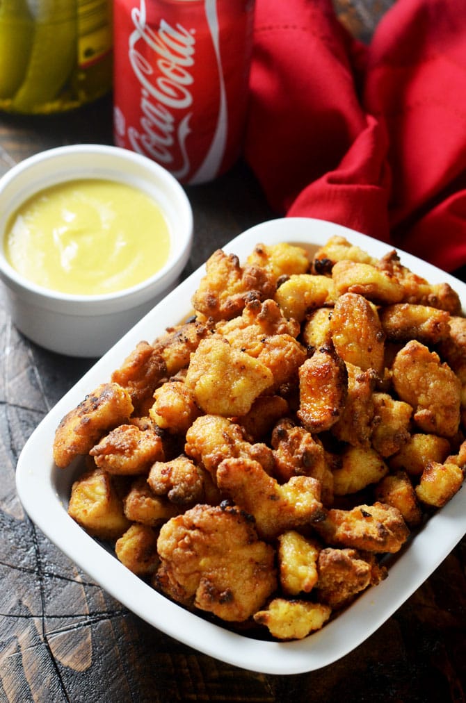 Baked Chicken Nuggets with Honey Mustard Dip. This baked version of the famous Chick-Fil-A nuggets is healthier, hassle-free, absolutely delicious, and easy to make at home! | hostthetoast.com