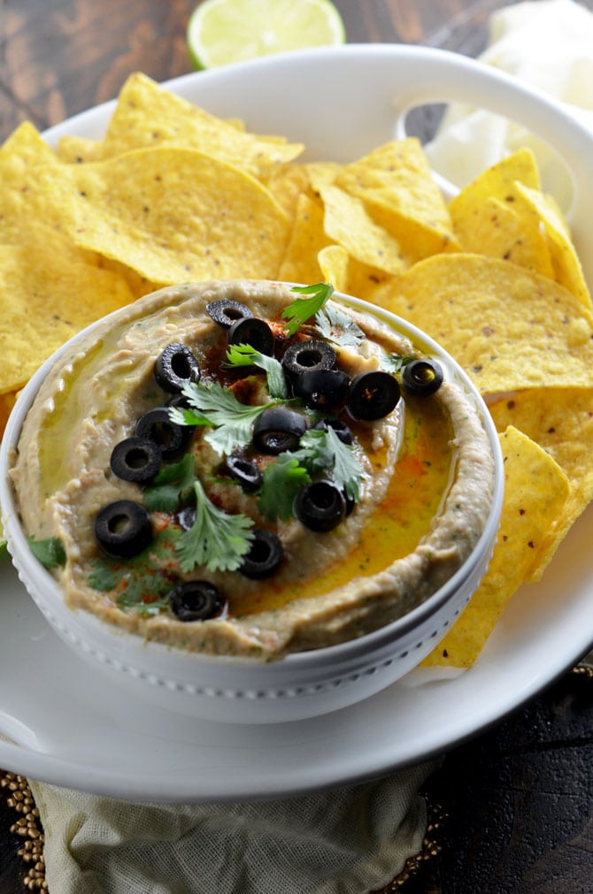 Jalapeno Pinto Bean "Hummus". This creamy dip is like a hybrid between spicy refried beans and hummus. Perfect for a party! | hostthetoast.com