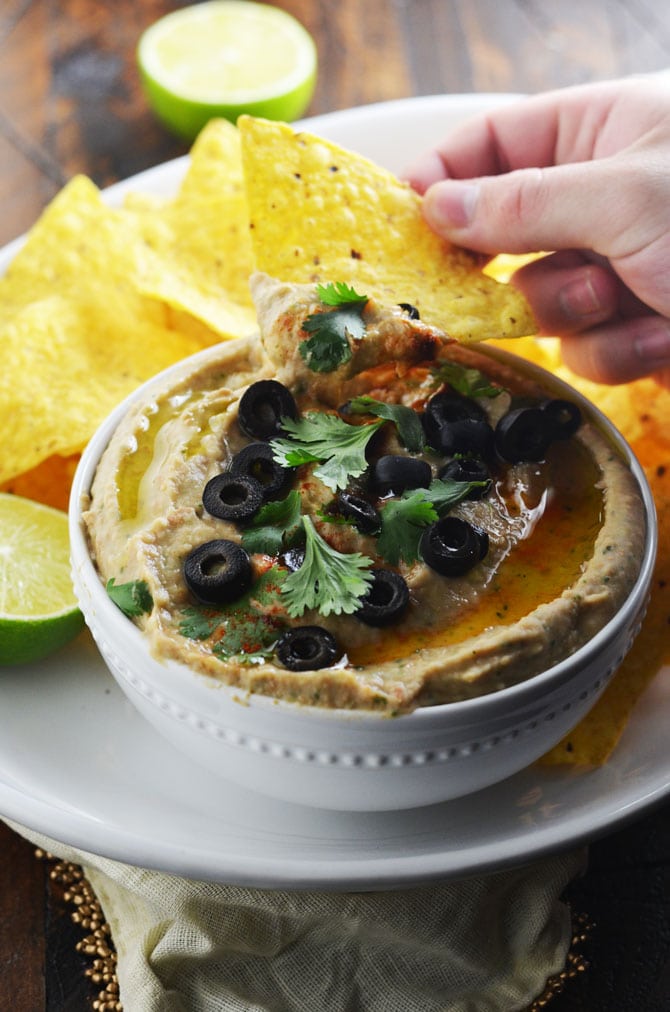 Jalapeno Pinto Bean "Hummus". This creamy dip is like a hybrid between spicy refried beans and hummus. Perfect for a party! | hostthetoast.com