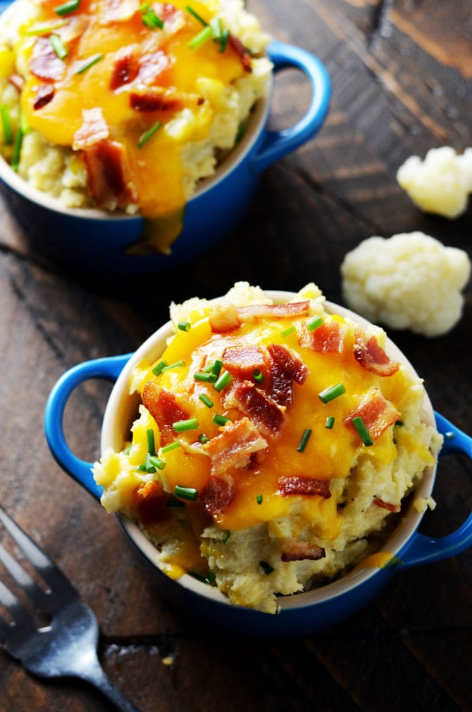 Loaded Mashed Cauliflower. Cheesy, creamy, mashed cauliflower with plenty of bacon that's low on calories. Perfect for a low carb alternative to mashed potatoes! | hostthetoast.com