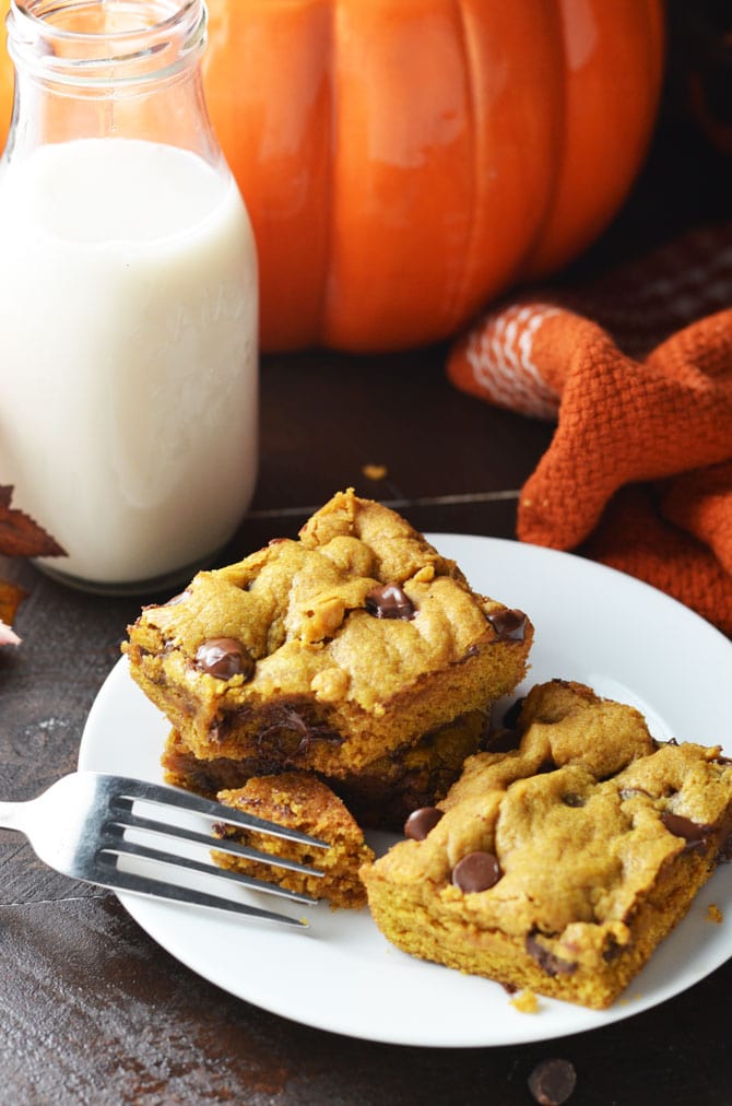 Pumpkin Chocolate Chip Cookie Bars. Perfect for fall and winter, these soft, pumpkin spiced desserts are a hit, and easy to make from scratch! | hostthetoast.com