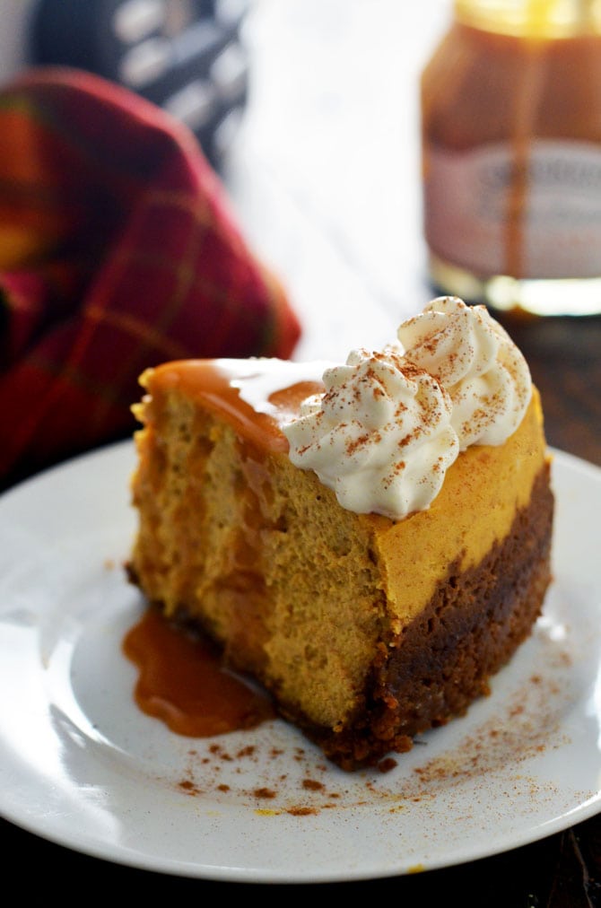 Slow Cooker Pumpkin Cheesecake. This drool-worthy fall dessert is cooked in the crock pot, which keeps it moist and creamy. Best of all, it takes up no room in the oven, so you can make it while you prepare your favorite comfort foods for date night or Thanksgiving dinner! | hostthetoast.com