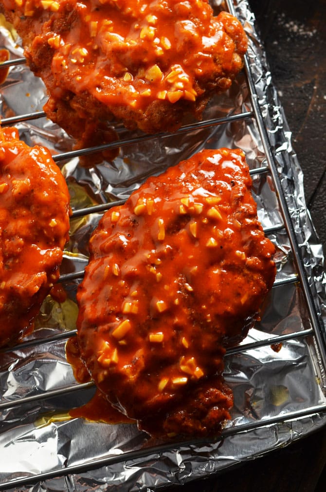 Spicy Garlic Crunch Chicken. Garlicky hot sauce-dipped, double-coated chicken breasts transform the tastiest hot wings into an entree. | hostthetoast.com
