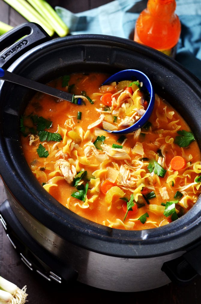 Slow Cooker Buffalo Chicken Noodle Soup. This healthy crock pot soup tastes like comfort with a kick! | hostthetoast.com