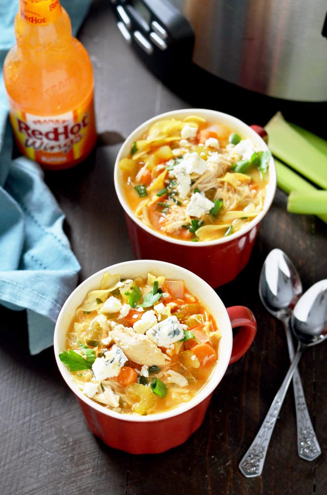 Slow Cooker Buffalo Chicken Noodle Soup. This healthy crock pot soup tastes like comfort with a kick! | hostthetoast.com