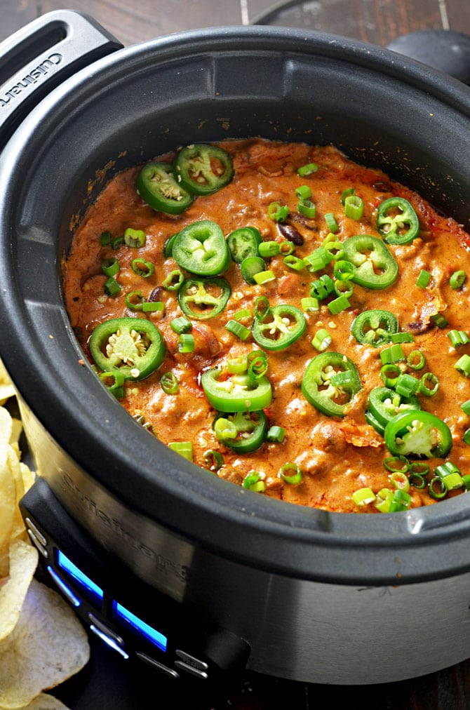 Slow Cooker Chili Cheese Dog Dip. This from-scratch dip is loaded with chili cheese dog flavor and really simple to make. Keep it warm in the slow cooker and serve it for the Super Bowl! | hostthetoast.com