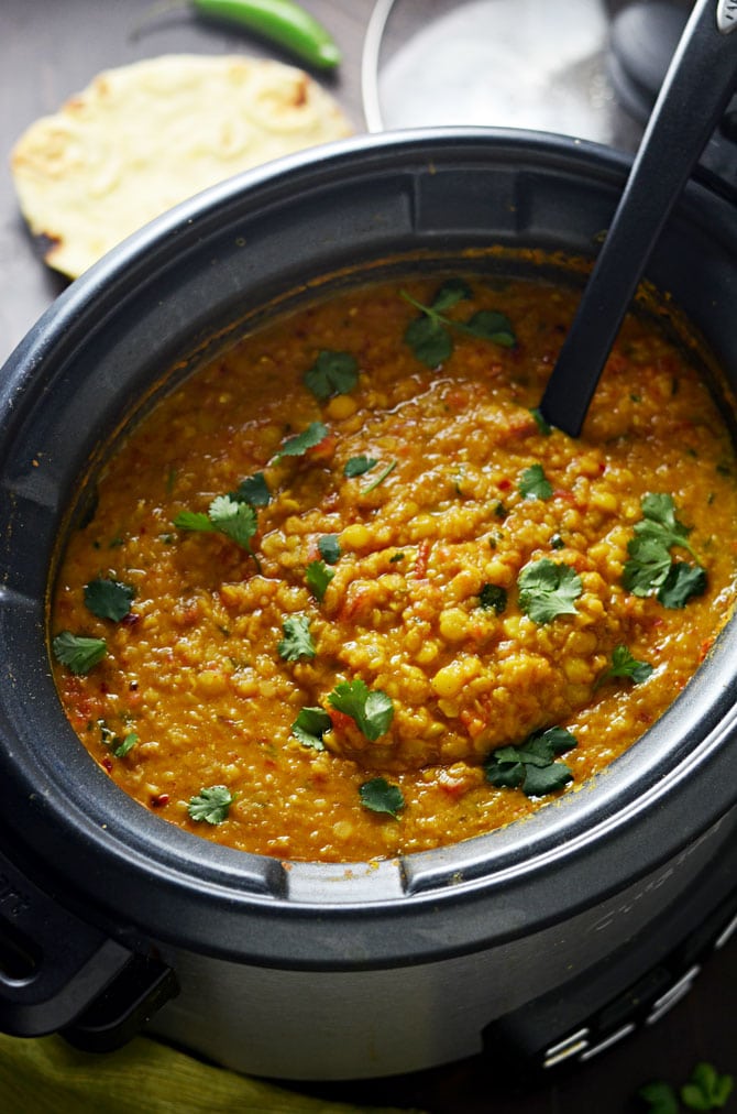 Slow Cooker Indian-Spiced Lentils. This crock pot dahl recipe is hearty, heavily spiced, and ultra-comforting. It doesn't require any crazy techniques, but winds up so flavorful! | hostthetoast.com