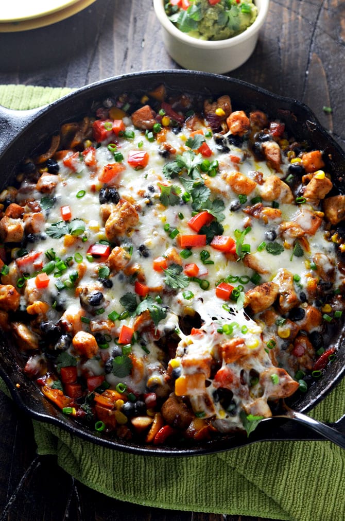 Southwestern Chicken and Sweet Potato Skillet. This is my new go-to weeknight dinner. Spicy, cheesy, and full of healthy ingredients. | hostthetoast.com