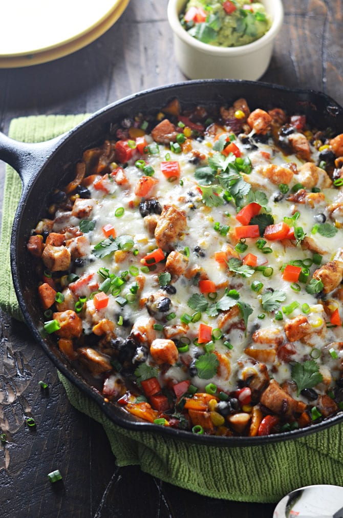 Southwestern Chicken and Sweet Potato Skillet. This is my new go-to weeknight dinner. Spicy, cheesy, and full of healthy ingredients. | hostthetoast.com